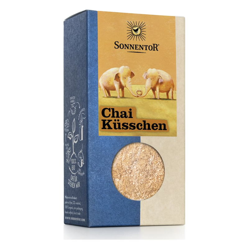 Verpackung von Chai Küsschen mit einer Illustrationen von zwei Elefanten und einem runden Sichtfenster auf der Vorderseite.