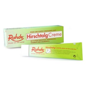 Rohde Hirschtalcreme in einer grünen Tube neben der Verpackung, die zur Hautpflege dient.