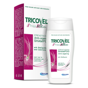 Flasche mit Tricovel Anti-Age-Shampoo, verpackt in einer bunten Schachtel, für geschwächtes Haar.