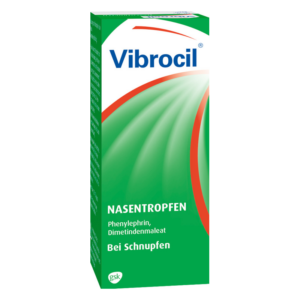 Grüne Verpackung mit weißer und blauer Schrift für Vibrocil Nasentropfen, geeignet bei Schnupfen.