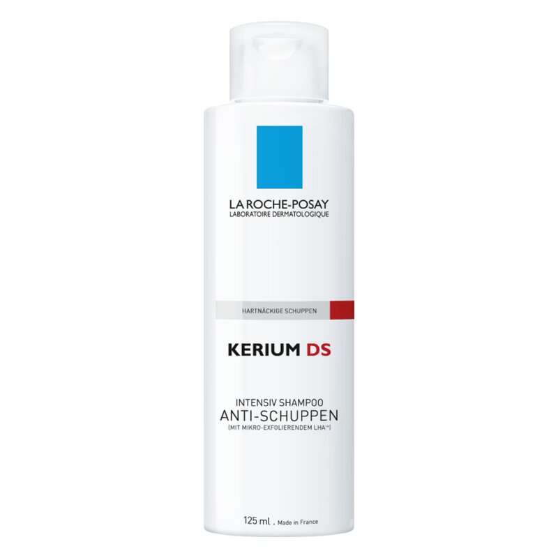 Weiße Flasche mit blauem quadratischen Logo und rotem Balken, enthält anti-schuppen Shampoo von La Roche-Posay.