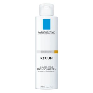 Helle Flasche mit weißem Inhalt, Etikett zeigt die Marke La Roche-Posay und die Produktbezeichnung Kerium. Schuppen-Shampoo für trockene Kopfhaut.