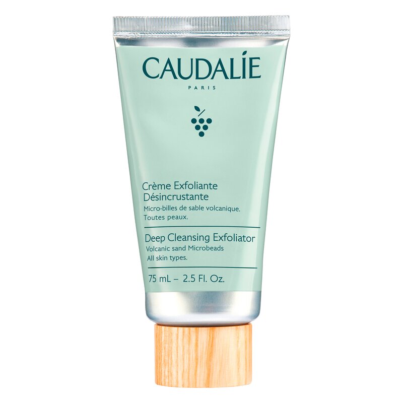 Exfoliant-Creme in einer 75 ml Tube mit einem Holzverschluss, mintgrüner Verpackung und Etikett mit Produktinformationen.