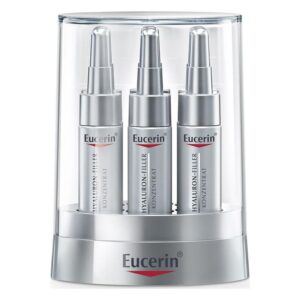 Drei silberne Eucerin Hyaluron-Filler Konzentrate im transparenten Verpackungsständer.