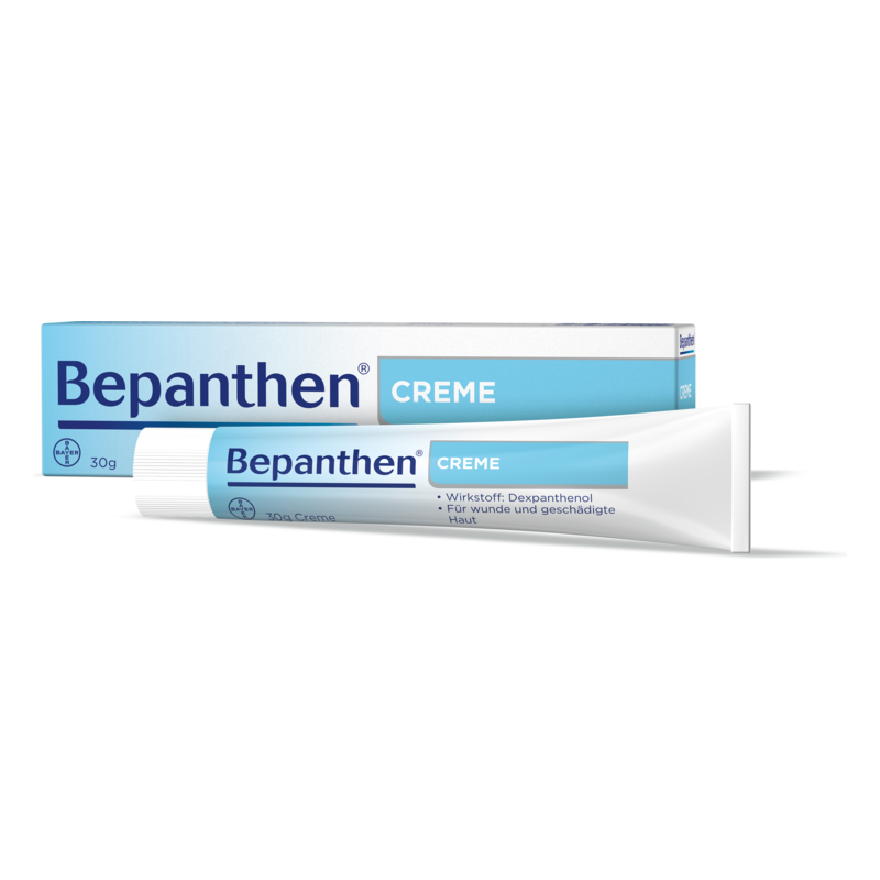 Bepanthen Creme in einer Tube mit blauer Schrift auf weißem Hintergrund, verpackt in einer Kartonage.