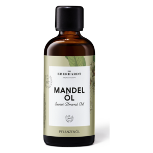 Flasche mit Süßmandelöl, braun, mit schwarz-weißer Etikettierung und Pflanzenmotiven, bio-zertifiziert.