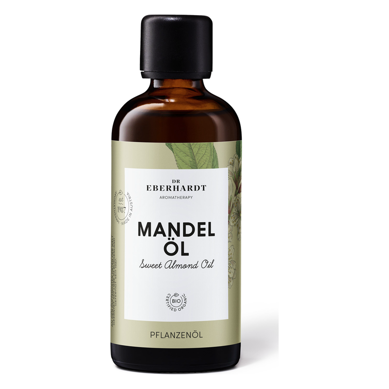 Flasche mit Süßmandelöl, braun, mit schwarz-weißer Etikettierung und Pflanzenmotiven, bio-zertifiziert.