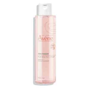Transparentes Behältnis mit Gesichts-Gel von Avène, geeignet für empfindliche Haut, rosafarbene Flüssigkeit.