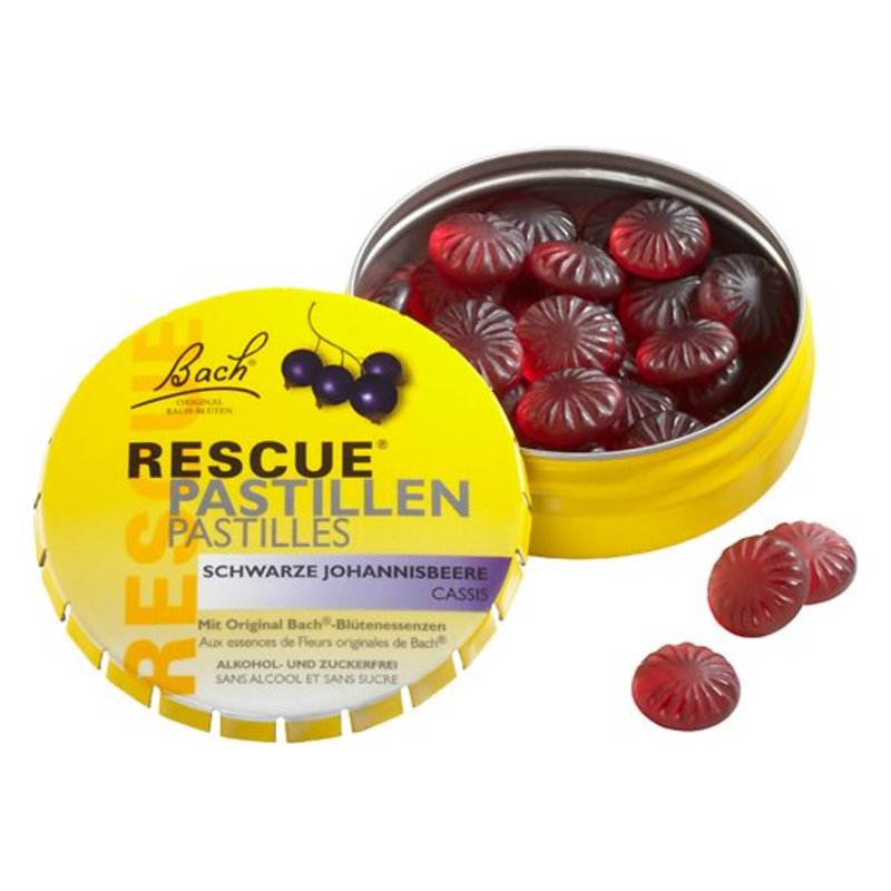 Runde pastillen in einer gelben Dose mit Aufschrift "RESCUE Pastillen Schwarze Johannisbeere" und Früchtemotiv.