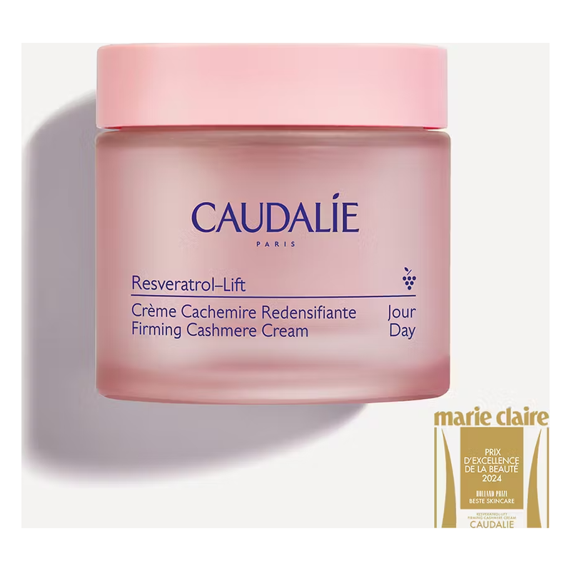 Runde Rosatönige Cremeverpackung von Caudalie mit Aufschrift zu einer straffenden Tagescreme.
