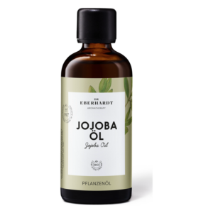Braune Glasflasche mit schwarzem Deckel, enthält Jojoba Öl, bio-zertifiziert, dekoriert mit Pflanzenmotiven.