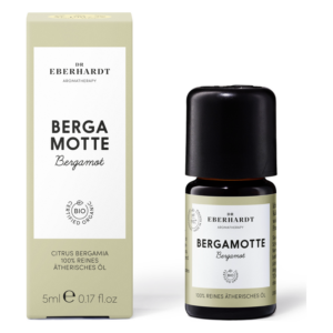 Flasche mit ätherischem Öl Bergamot in einer umweltfreundlichen Verpackung, dekorativ beschriftet.