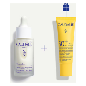 Set aus einem aufhellenden Serum und einer sonnenschutzmittel für sehr hohe UV-Schutzwirkung in gelber Verpackung.